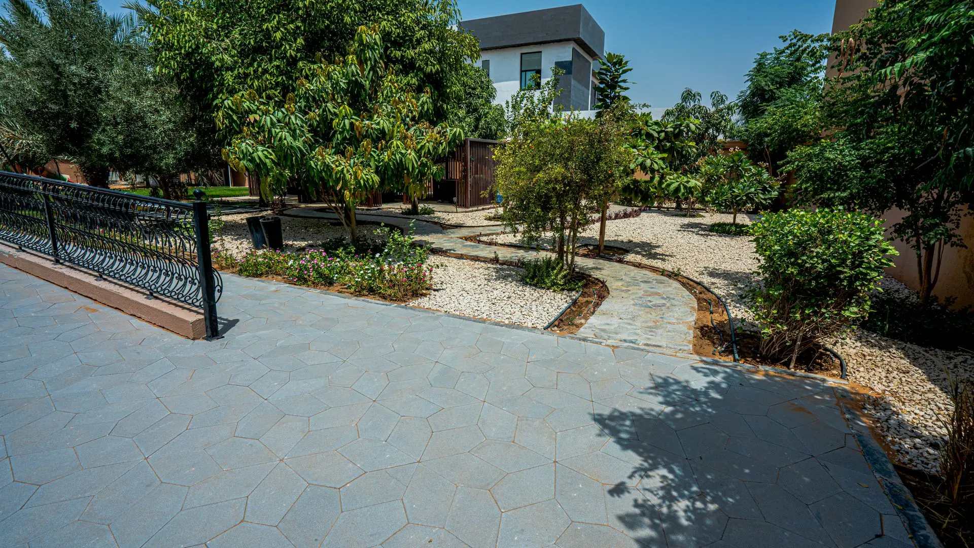 Modern large-format interlocking pasco pavers for a backyard patio and seating area.
